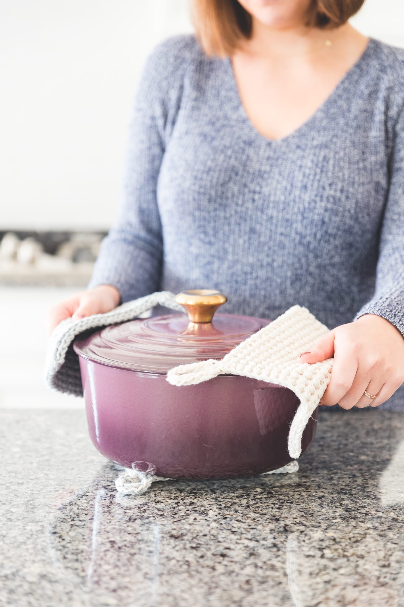 Crochet potholders have an i-cord loop for style and easy storage.