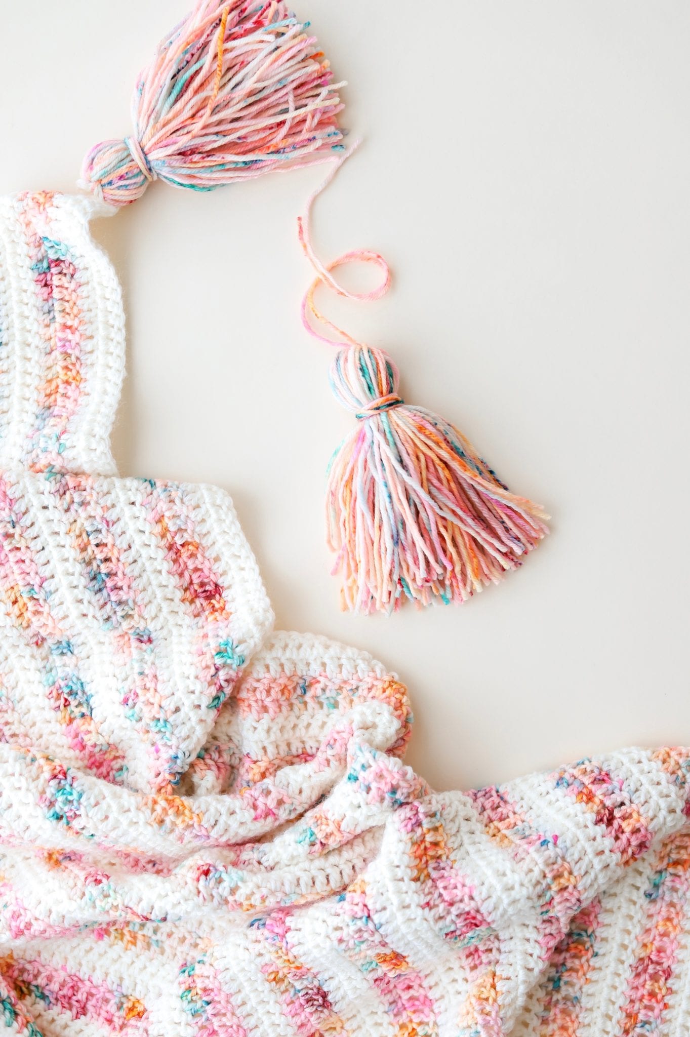 Finishing steps of a crochet shawl after wet blocking when I add the final tassels